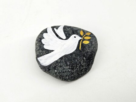 herdenkingssteen met witte vogel en gouden takje